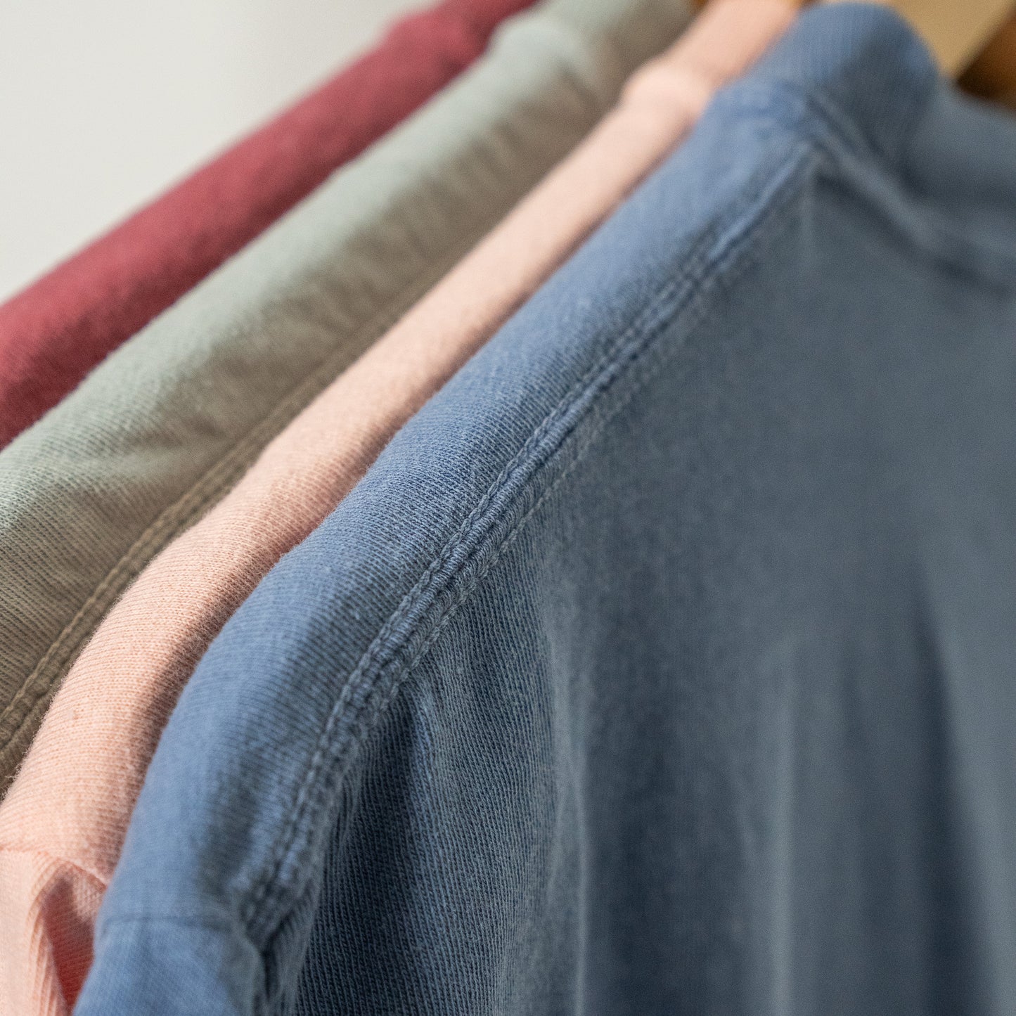 Overcomer Tee styled with casual jeans, worn by woman standing outdoors  