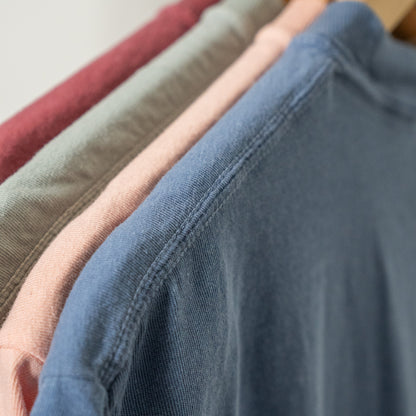 Overcomer Tee styled with casual jeans, worn by woman standing outdoors  