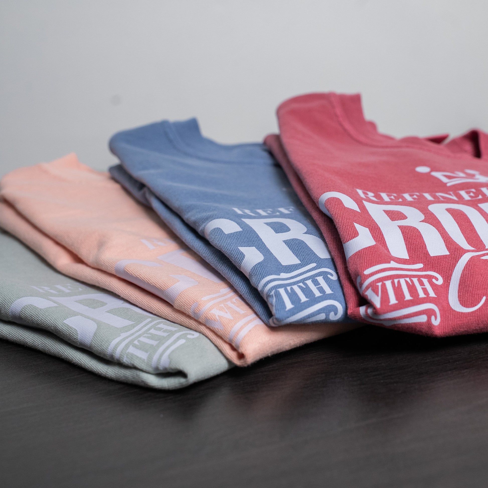 Women’s motivational t-shirt laid flat, highlighting the fabric texture and print detail  