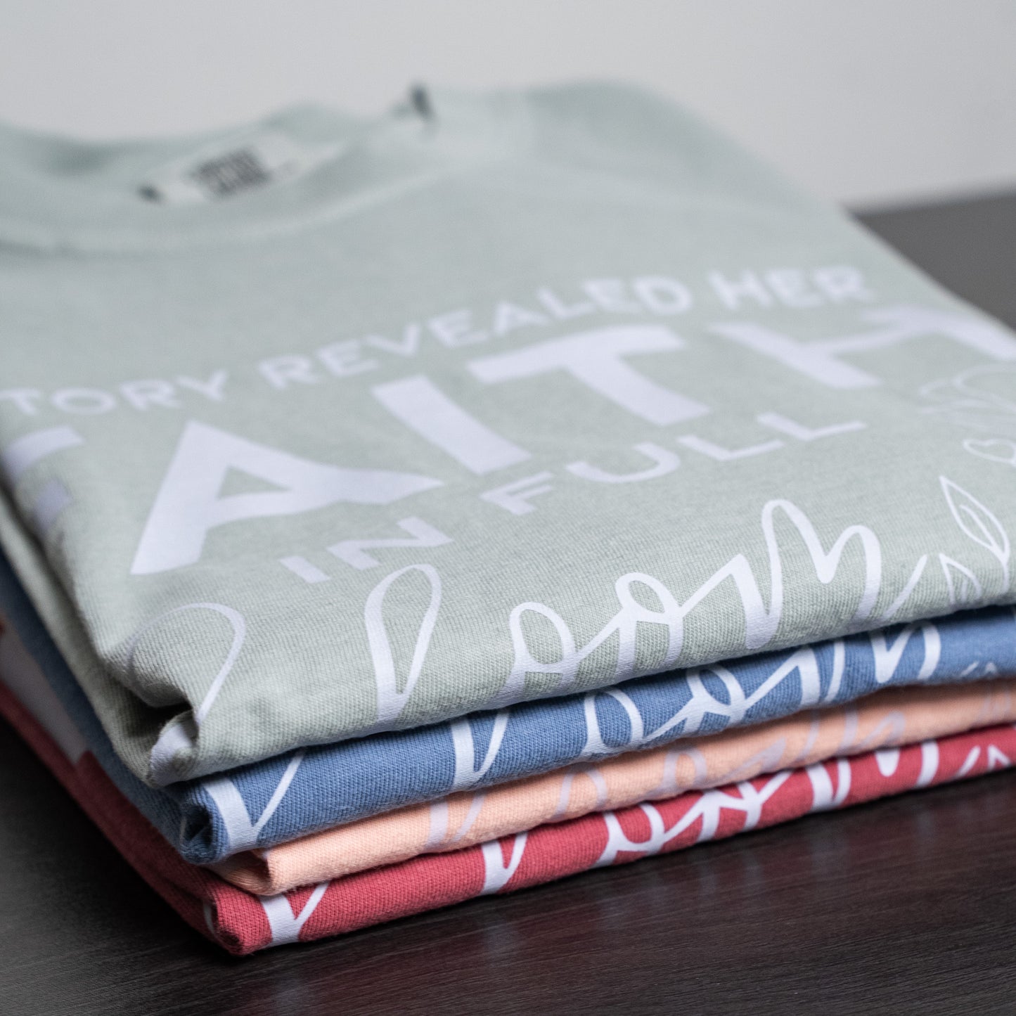 Model wearing the Victory Revealed tee with casual jeans against a simple backdrop  
