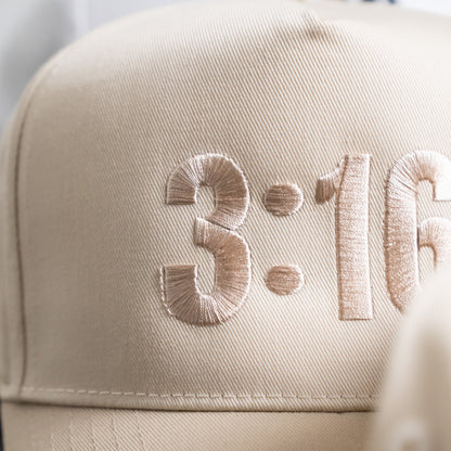 Back view showing adjustable strap on white "3:16" five-panel hat made from durable twill fabric