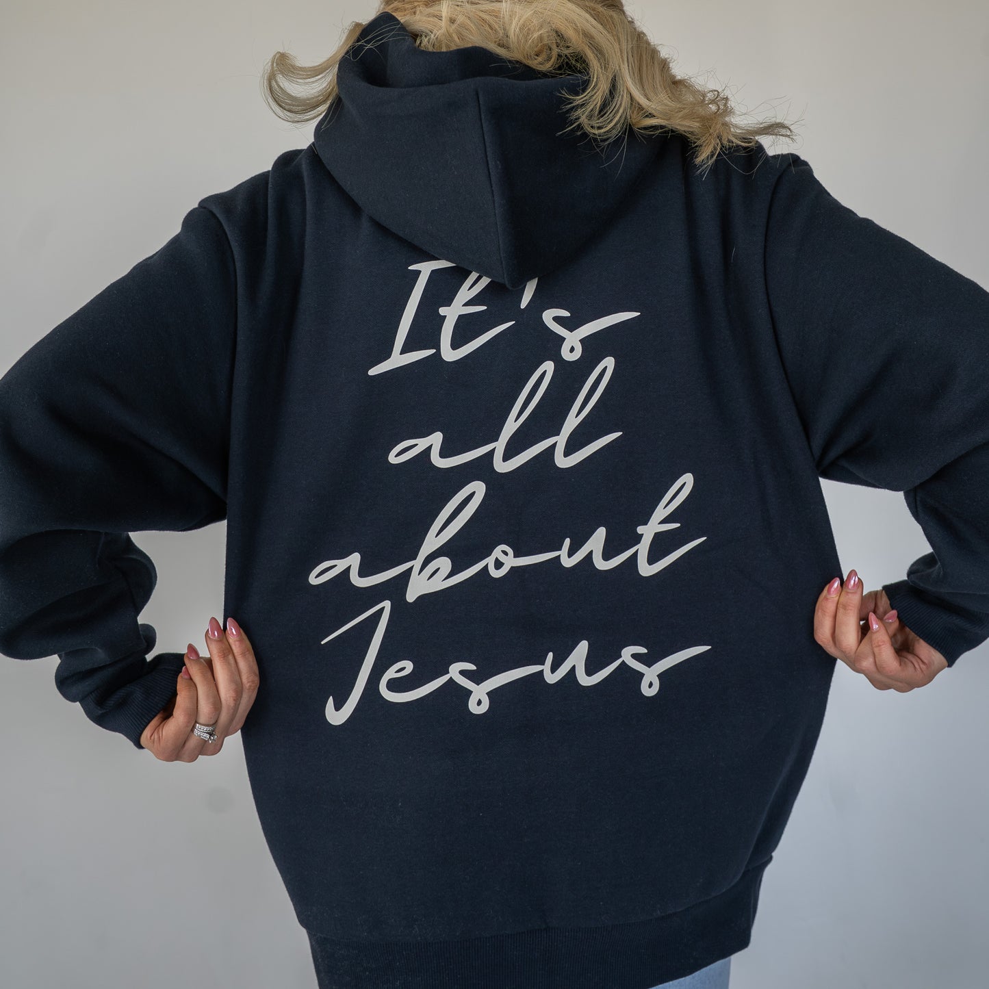 Close-up of soft fabric texture on premium Christian-themed hoodie  
