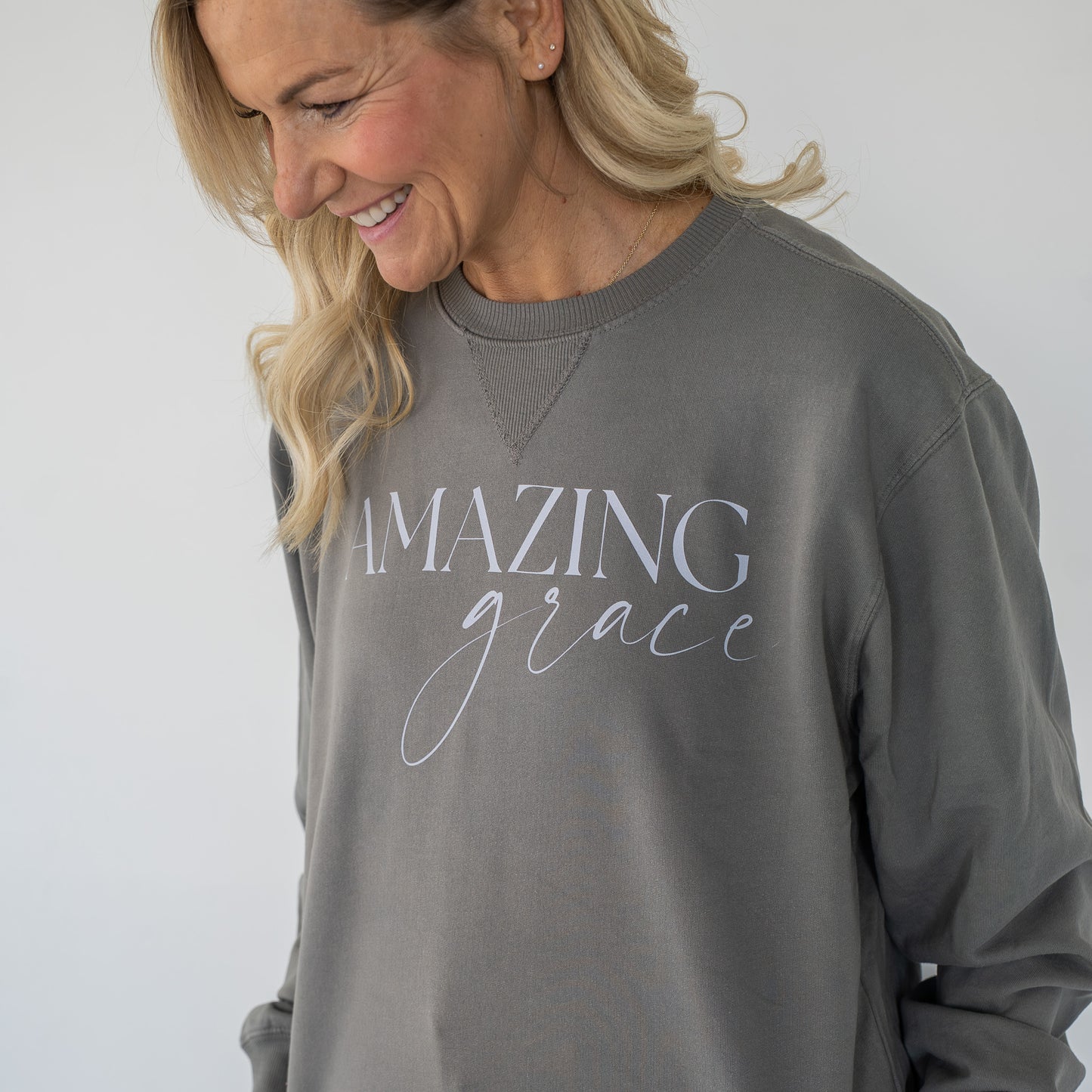 Close-up of soft fabric texture and stitched hem on the crewneck sweatshirt  