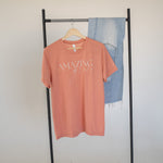 Model wearing the Amazing Grace faith-based t-shirt paired with casual jeans  