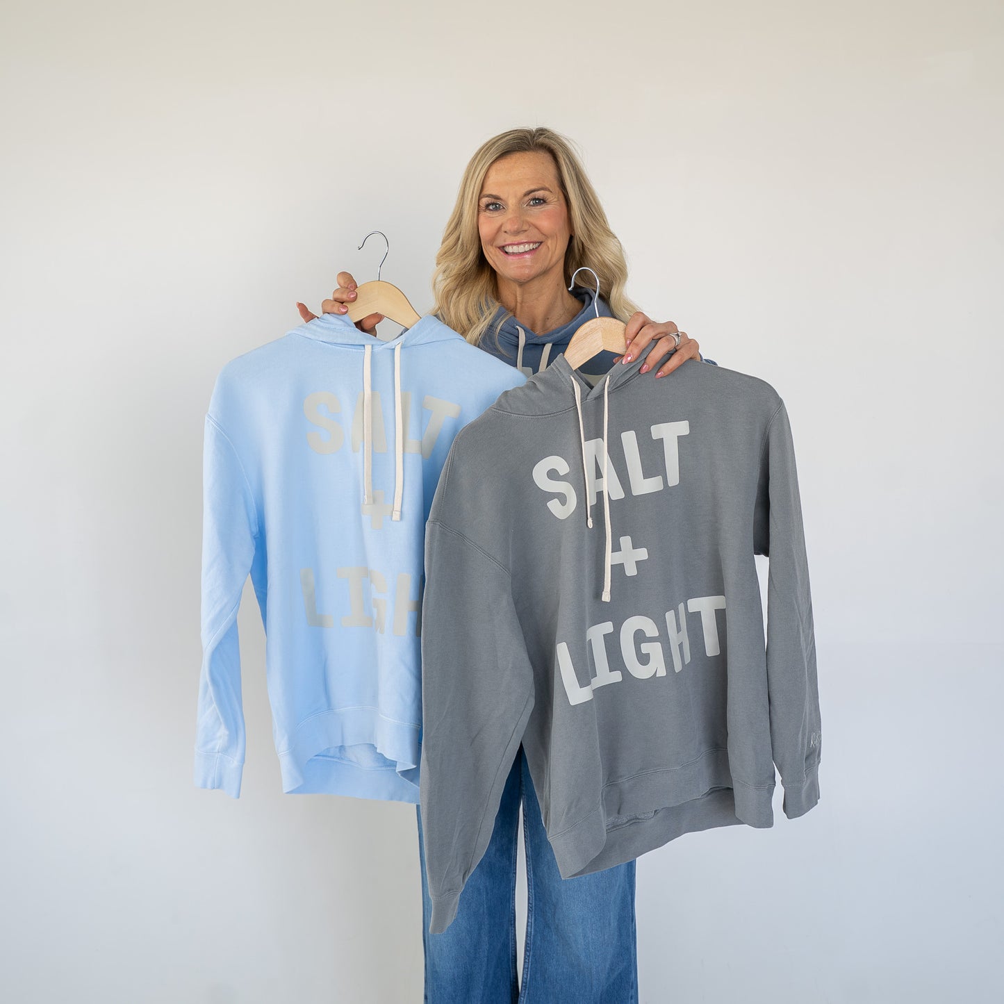 Side angle showing the comfortable fit and long sleeves of the hoodie  