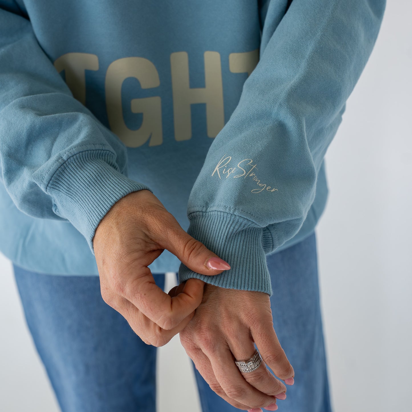 Model wearing Salt + Light crewneck sweatshirt in casual outdoor setting  