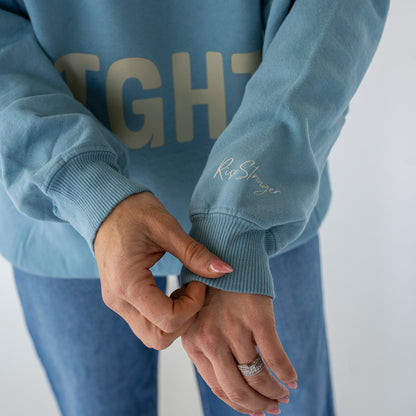 Model wearing Salt + Light crewneck sweatshirt in casual outdoor setting  