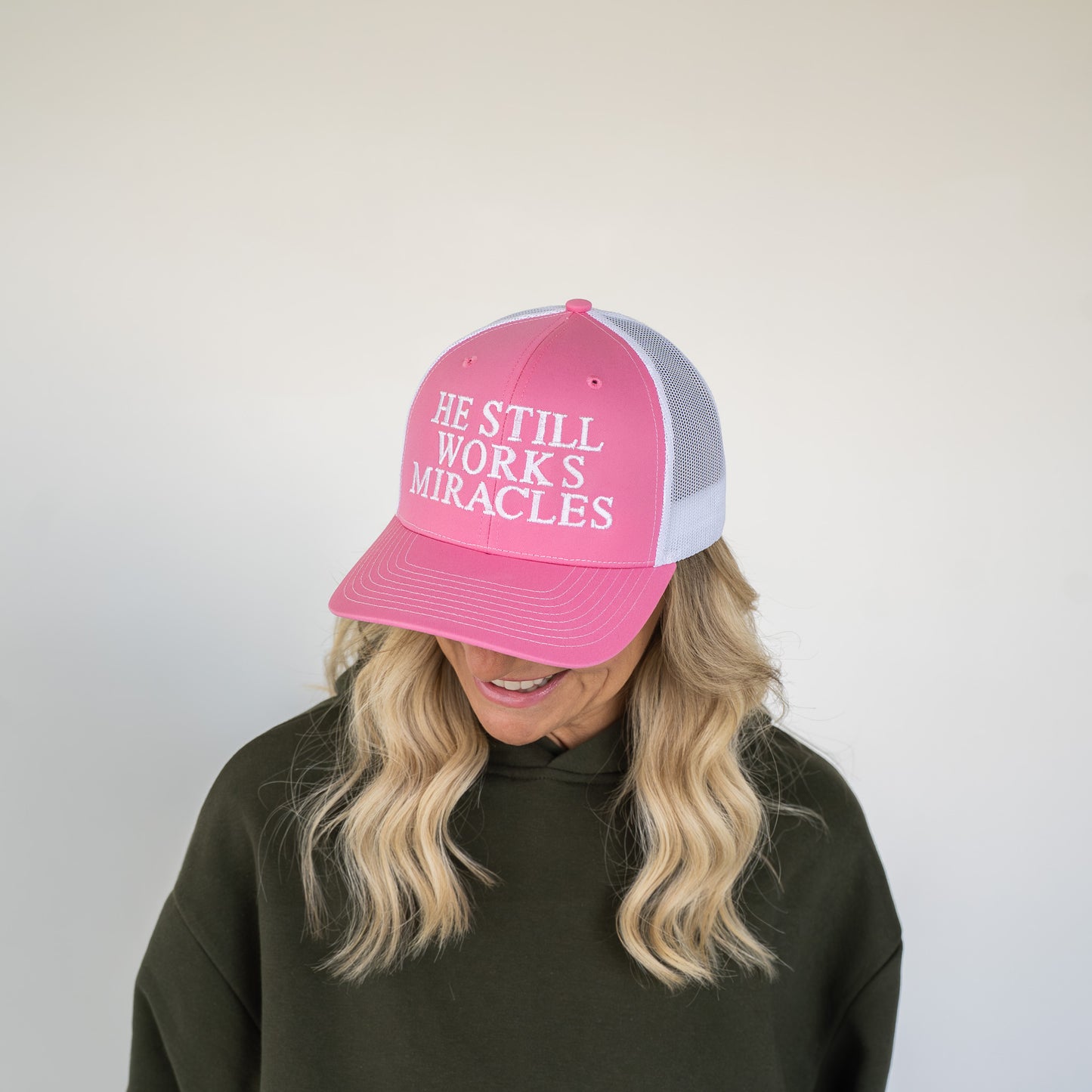 He Still Works Miracles Trucker Cap