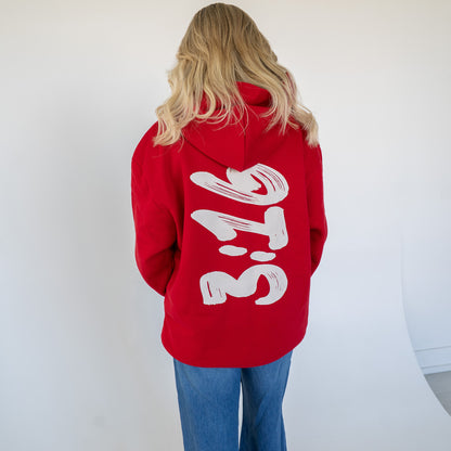 Back view highlighting large white 3:16 graphic on the dark hoodie  