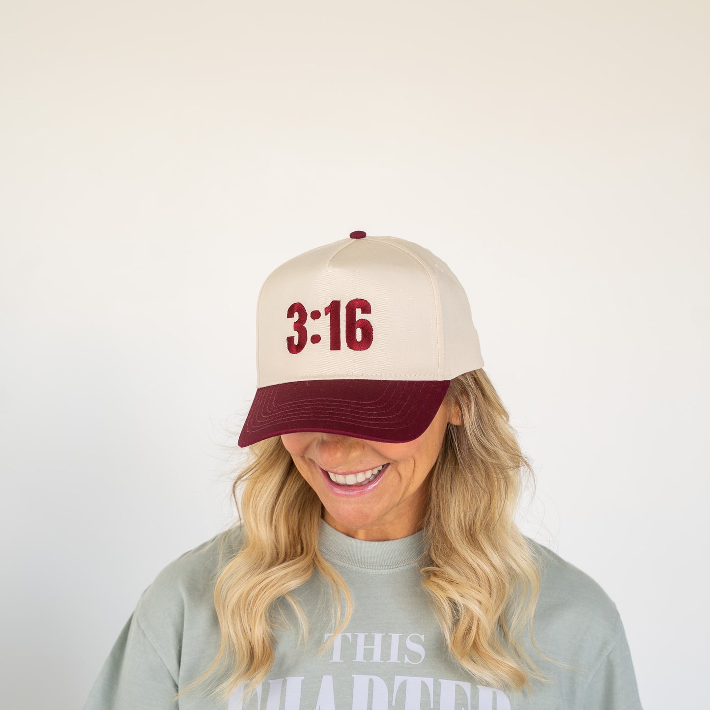 White five-panel cap with black embroidered "3:16" on front panel, adjustable back strap visible  