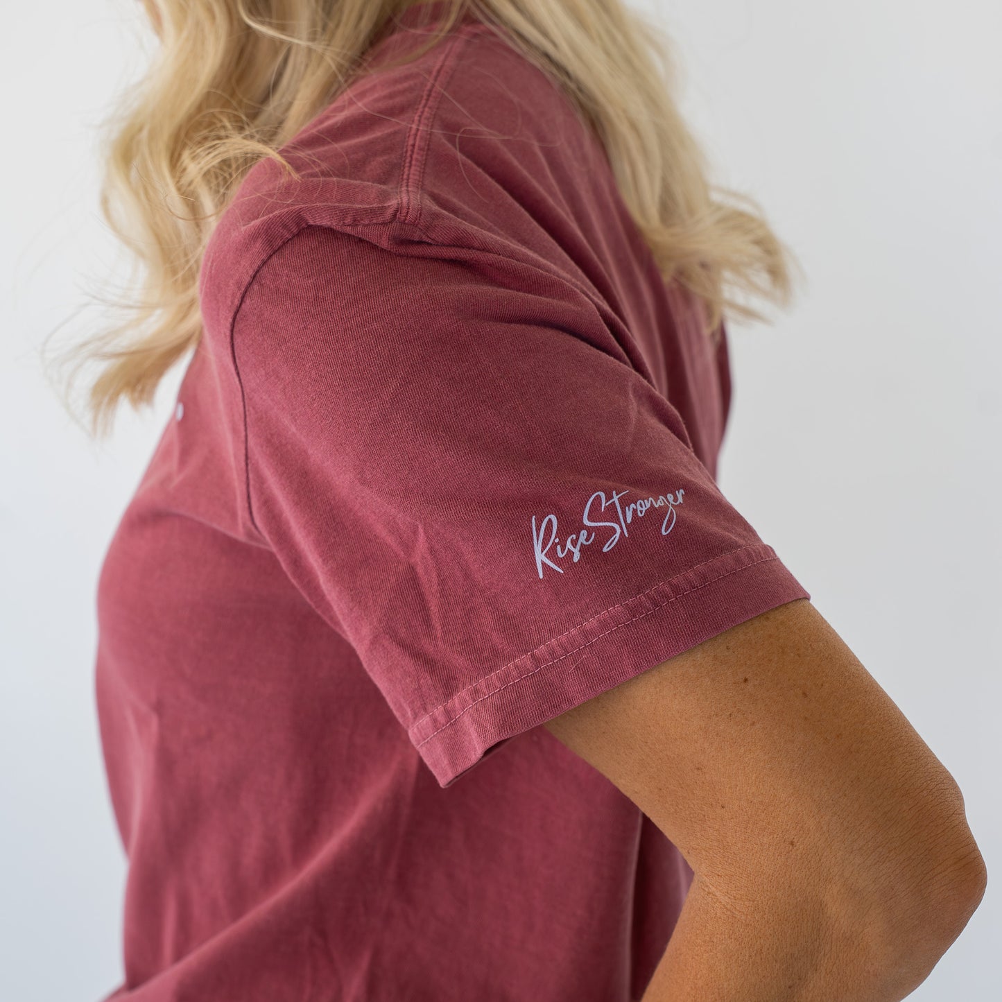 Folded Overcomer Tee displaying the uplifting message on the front design