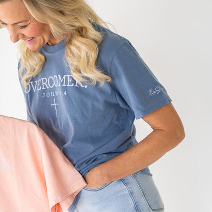 Close-up of the Overcomer Tee fabric showing detailed print and texture  