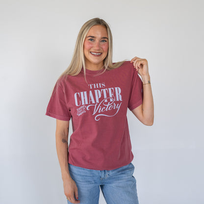 Front view of white women's tee with "This Chapter Ends in Victory" inspirational text  
