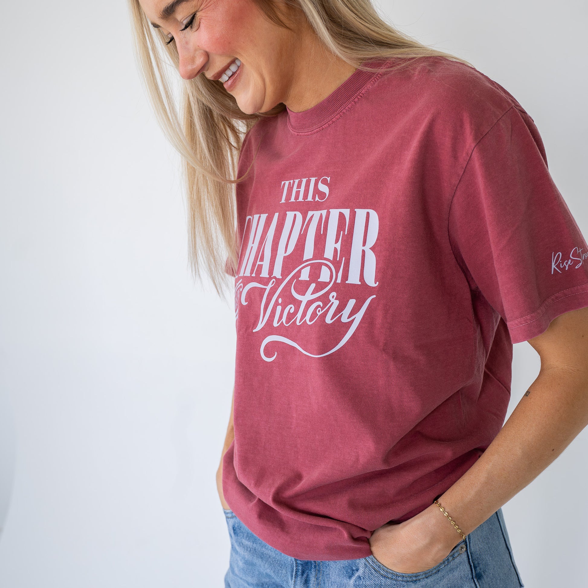 Close-up of fabric texture and printed motivational message on women's spiritual t-shirt  