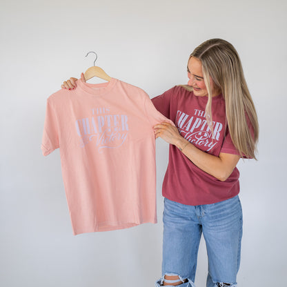 Model wearing victory-themed Christian motivational tee in casual outdoor setting  