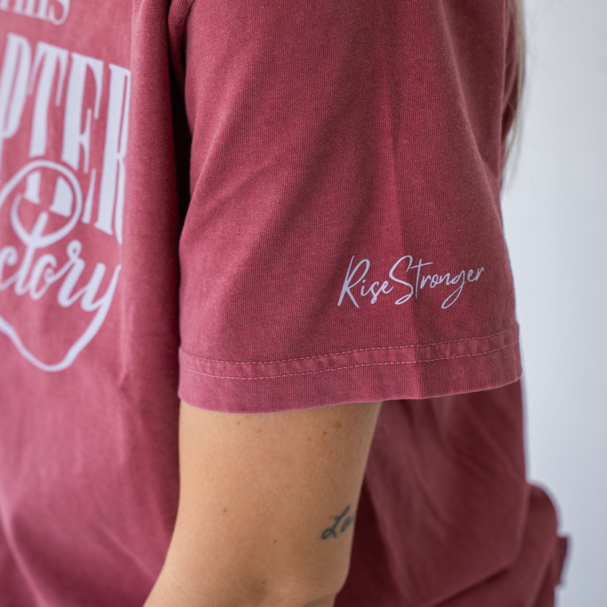 Side angle of lightweight women's shirt featuring positive faith and strength design  