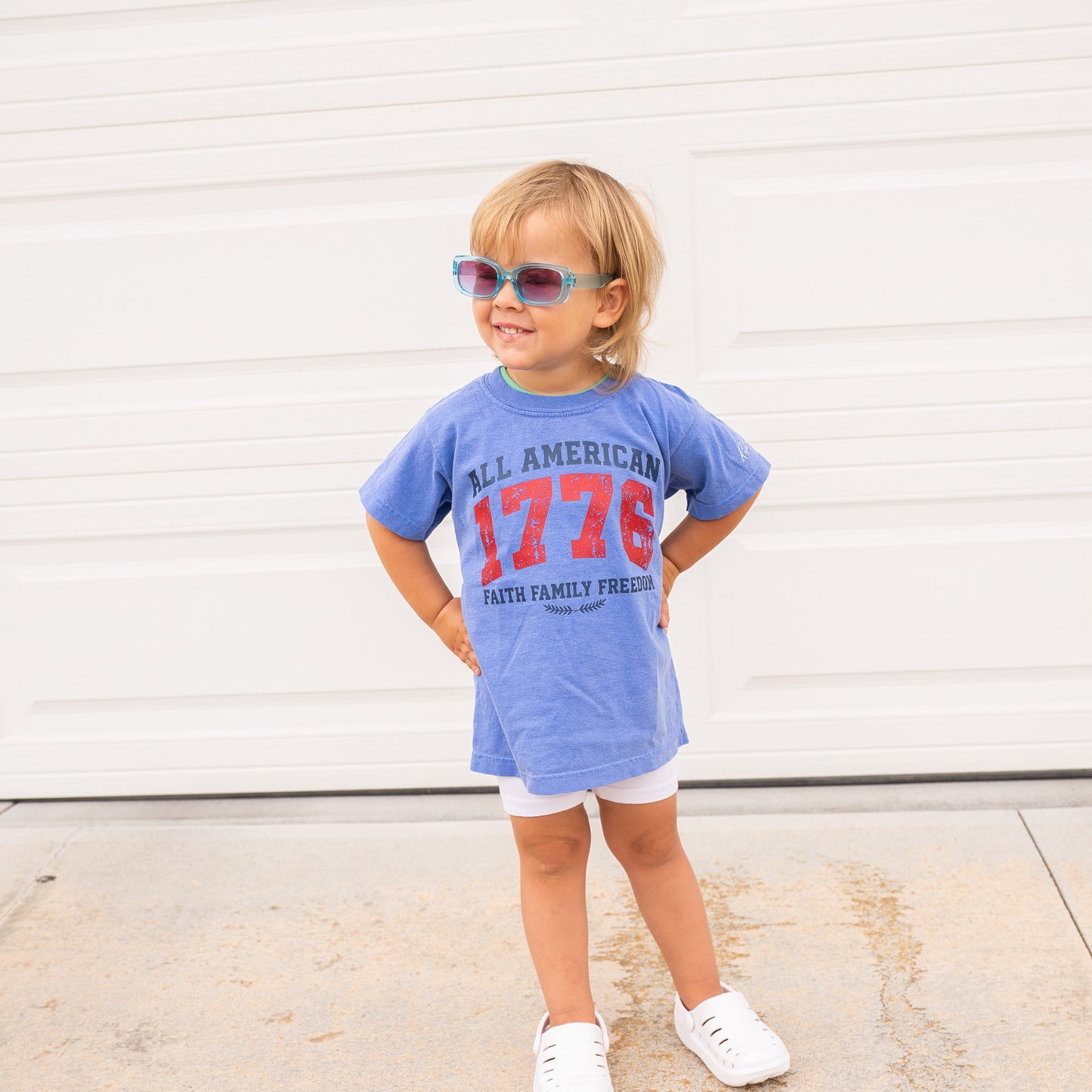 Close-up of fabric texture and printed patriotic faith graphic on youth short sleeve shirt  