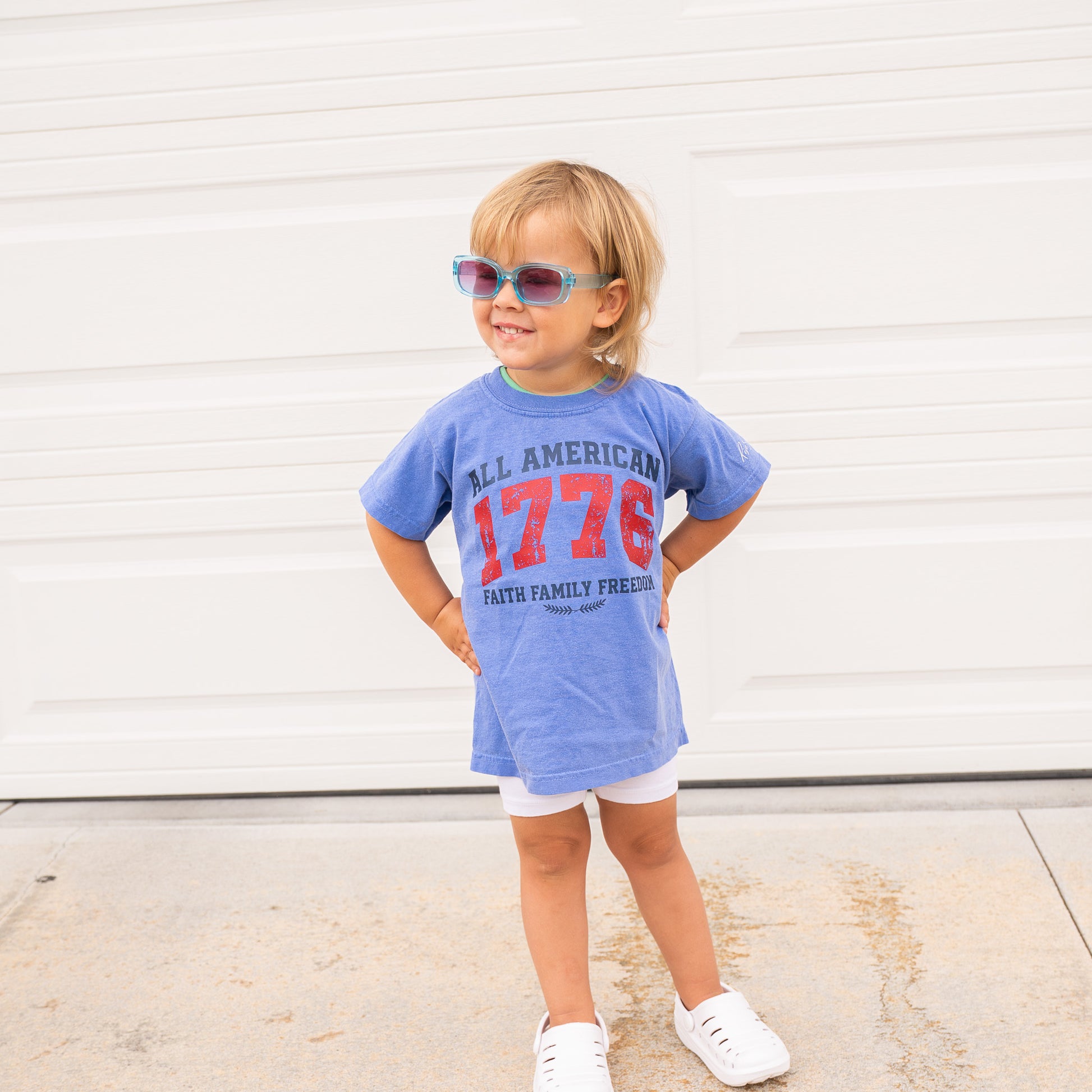 Close-up of fabric texture and printed patriotic faith graphic on youth short sleeve shirt  
