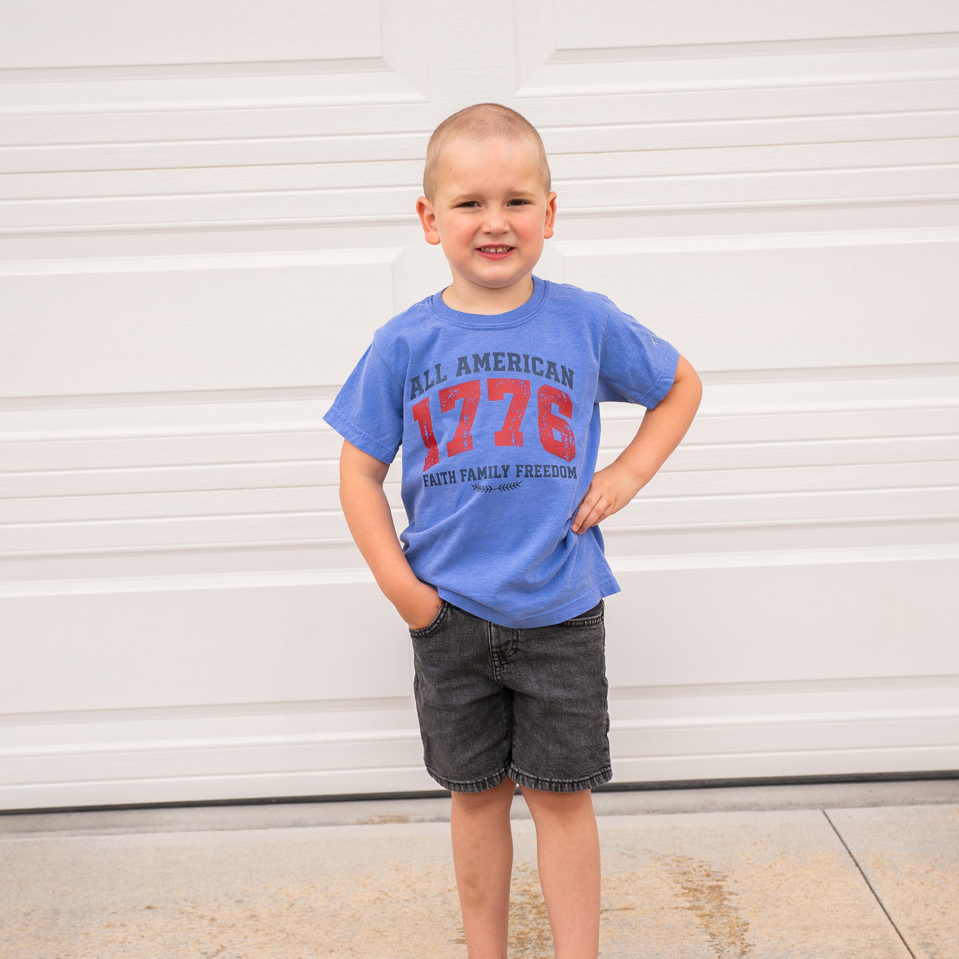 Back view of 1776 All American youth shirt displaying simple, solid color with soft wearable material