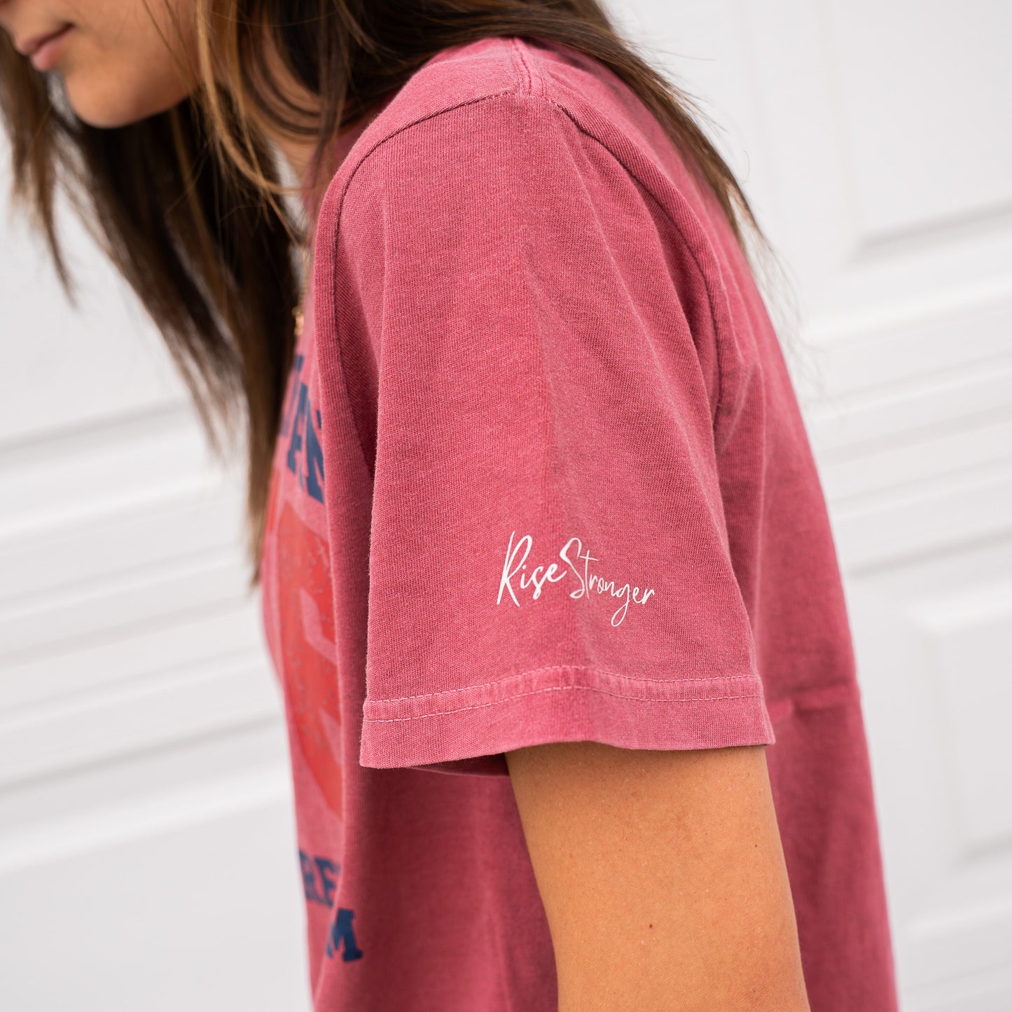 Close-up side view of man in blue 1776 t-shirt showing print detail