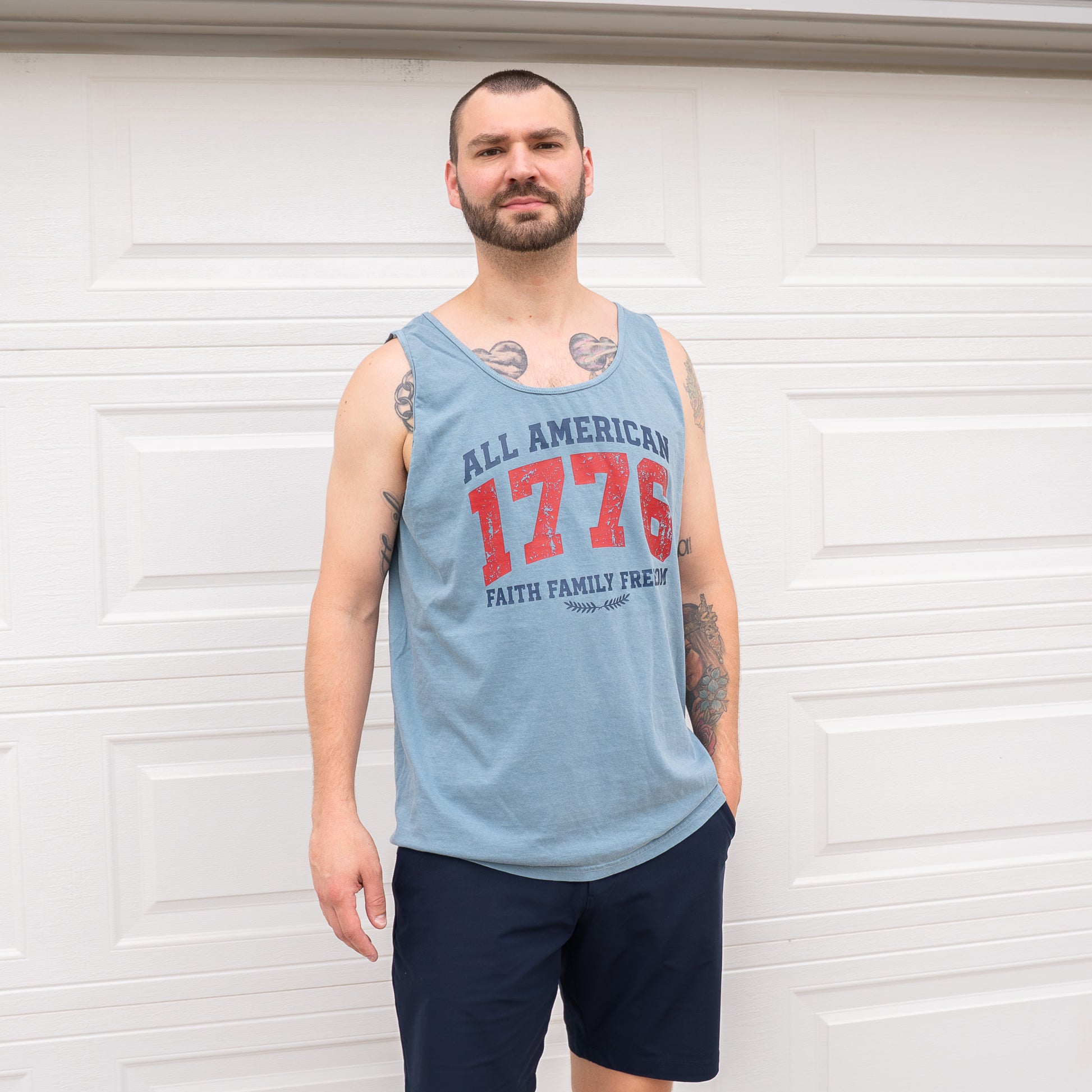 Lifestyle image of woman wearing faith-inspired American pride tank top
