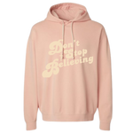 Peach colored Christian hoodie with text that reads 'Don't Stop Believing.'