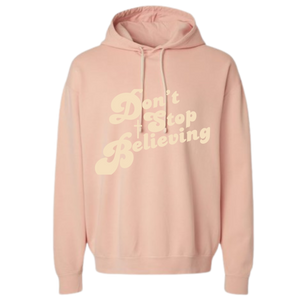 Peach colored Christian hoodie with text that reads 'Don't Stop Believing.'