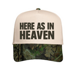 Natural / Mossy Oak hat with 'Here As In Heaven' text.