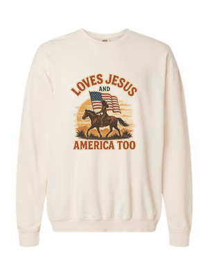 Beige Christian patriotic hoodie with an American flag and text that reads Loves Jesus and America Too.