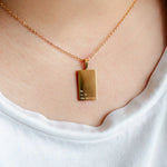 Woman wearing He Is in the Waiting gold necklace – faith-inspired jewelry