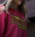 Female wearing a red sweatshirt with 'Revival Starts Here' text.