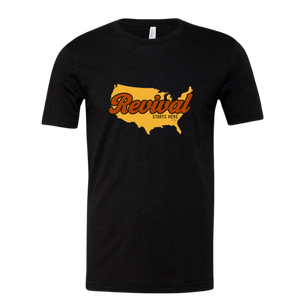 Black t-shirt with yellow USA graphic overlayed by  'Revival Starts Here'.