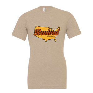 Beige t-shirt with a graphic of the United States and 'Revival Starts Here' text.