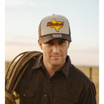 Cowboy wearing a brown and tan foam trucker hat with 'Revival Starts Here' overlaying the state of Texas.