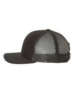Sideview of a black Richardson 112 trucker cap