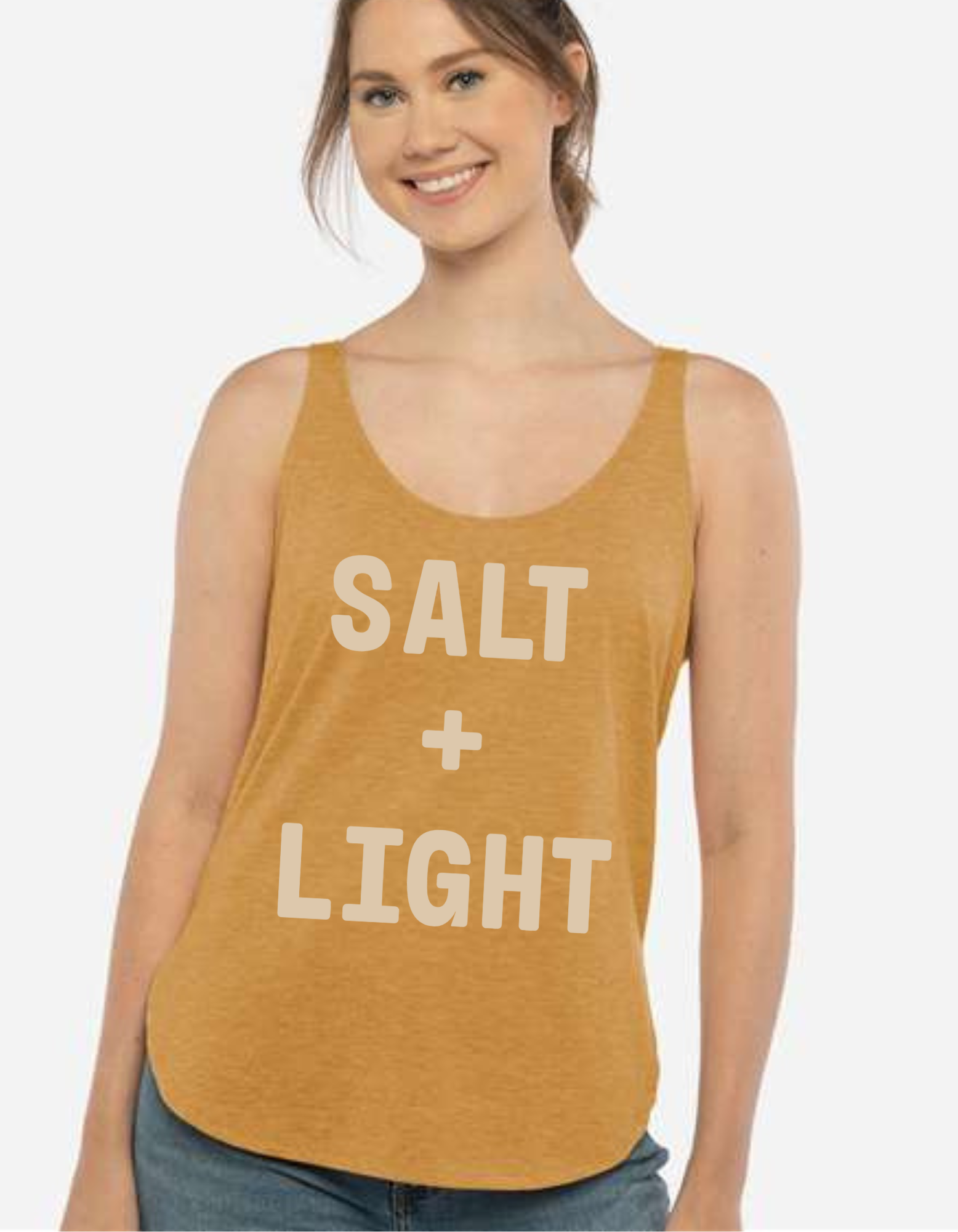 Christian woman wearing a gold tank top with 'SALT + LIGHT' text.