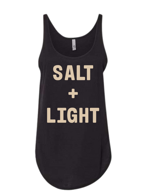 Black Christian tank top with 'SALT + LIGHT' text on the front in cream color. 
