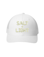 White Christian trucker hat with 'SALT + LIGHT' text in gold embroidered on the front