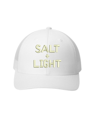 White Christian trucker hat with 'SALT + LIGHT' text in gold embroidered on the front