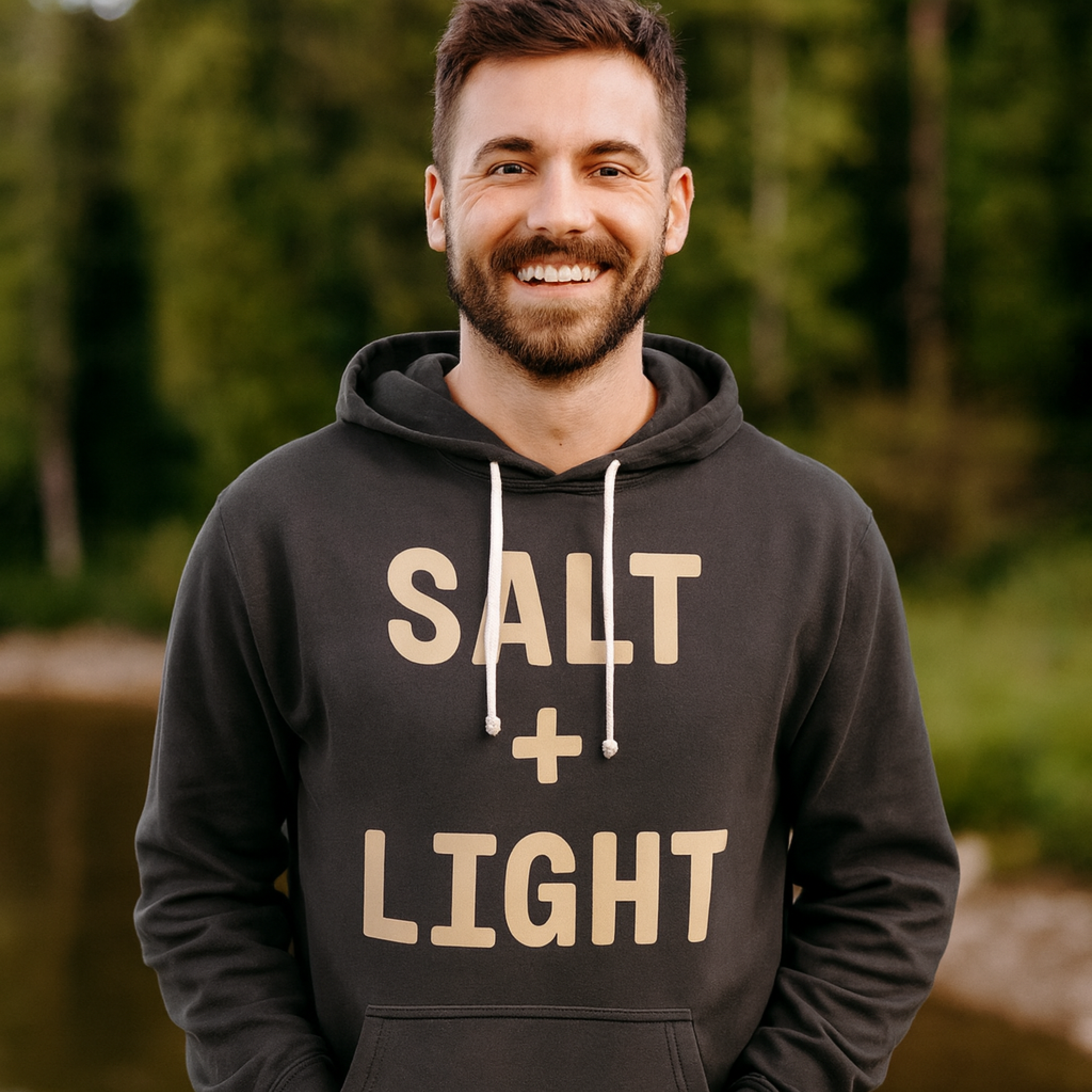 Christian man wearing a 'SALT + LIGHT' hoodie.