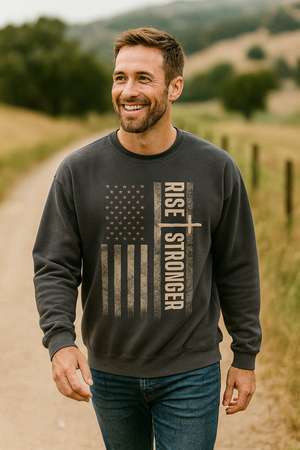 Man wearing a Christian sweatshirt with 'Rise Stronger' text and American flag design.