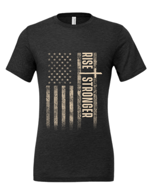 Christian Patriotic tee in dark grey with tattered American flag, a cross and Rise Stronger text on the front in cream color.