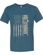 Christian Patriotic tee in steel blue with tattered American flag, a cross and Rise Stronger on the front in cream color.