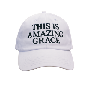 White Christian cap with 'THIS IS AMAZING GRACE' text embroidered in blue