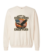 A cream colored Christian & patriotic crewneck sweatshirt with Where the Stars & Stripes and Eagle Flies on the front. 